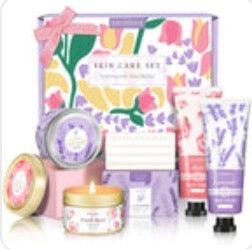 Curated gifts for women including skincare, candles, and cozy essentials in a floral-themed box