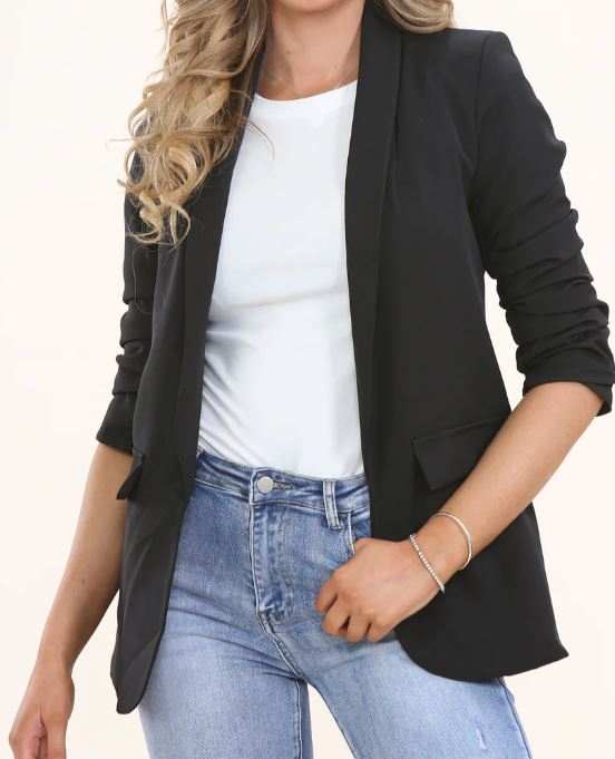 Black women’s blazer with ruched sleeves in tailored fit, styled with jeans