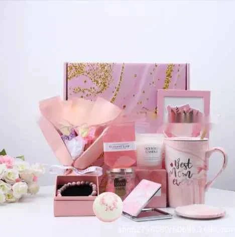 Aromatherapy candle gift set with candles, soap, mug, and floral accents in pink packaging