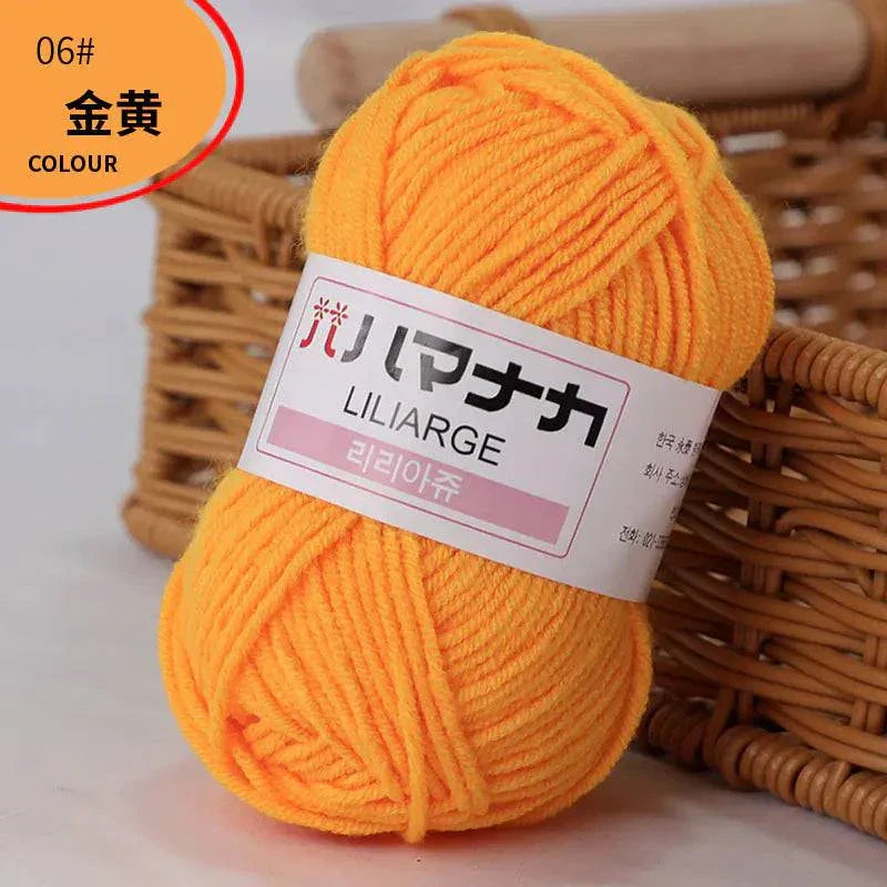 4-ply milk cotton yarn ball in bright orange for baby dolls and crochet projects