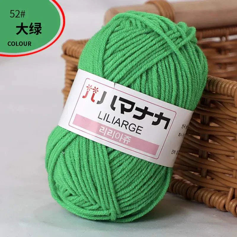 Bright green 4-ply milk cotton yarn ball for baby dolls and crochet projects