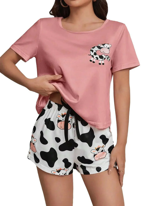 WDIRARA Womens Sleepwear pink short sleeve tee with cartoon cow print and matching black and white cow print knot shorts pajama set