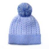 Light blue recycled yarn herringbone cable knit hat with pom pom and ribbed cuff