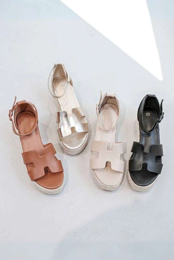 Beige strap wedge sandals with supportive strap design and comfortable wedge sole for summer wear