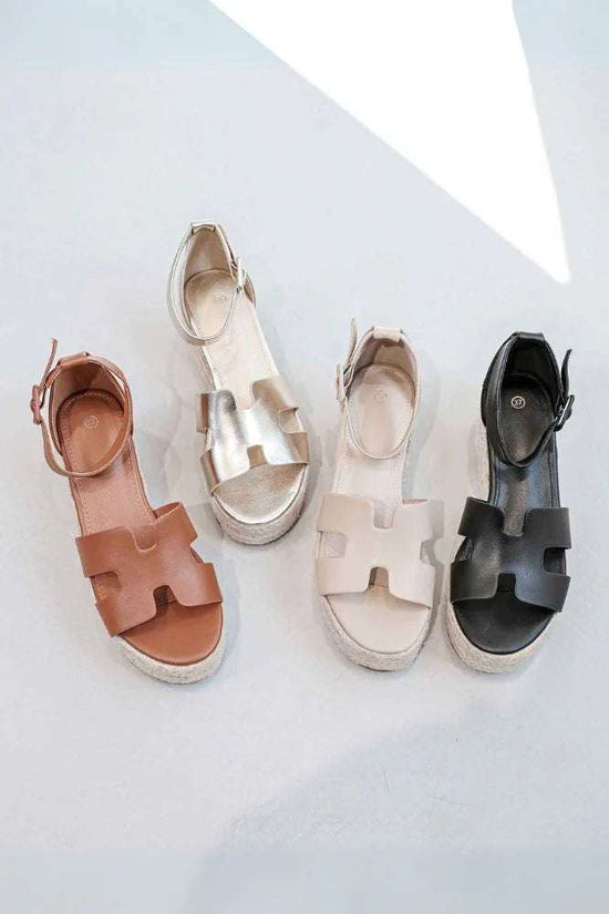 Beige strap wedge sandals with supportive strap design and comfortable wedge sole for summer wear