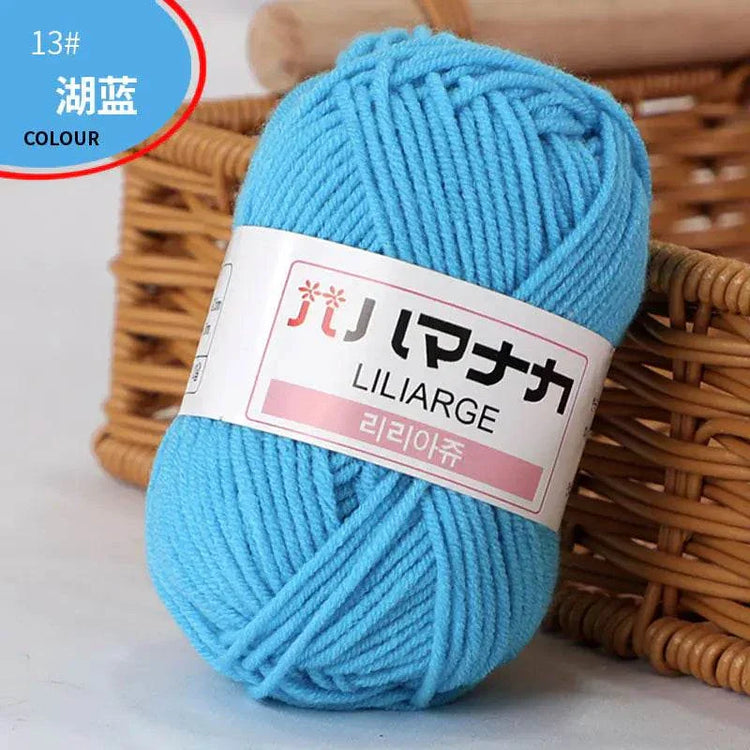 Blue 4-ply milk cotton yarn ball for baby dolls and crochet projects
