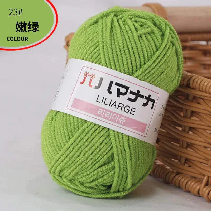 Green 4-ply milk cotton yarn ball for baby dolls and crochet projects