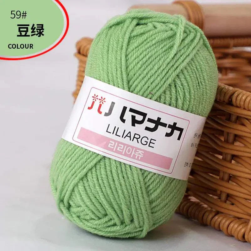 Green 4-ply Milk Cotton Yarn ball for baby dolls and crochet projects with soft texture and durable fibers