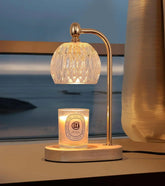 Electric candle warming light with crystal lamp shade and wooden base for safe, smoke-free candle melting and home decor.
