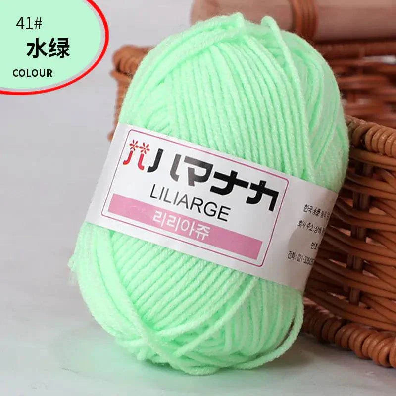 Soft mint green 4-ply milk cotton yarn ball for baby dolls and crochet projects