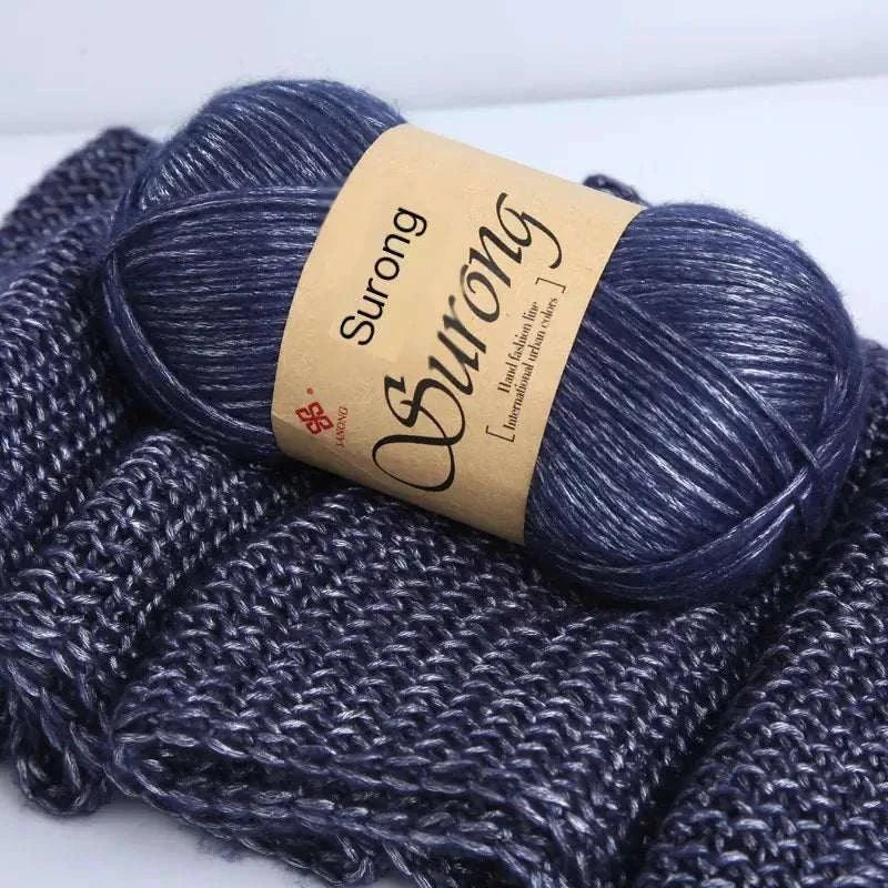 Premium softer yarn ball on knitted fabric, ideal for DIY knitting scarves and hats projects