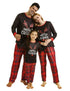 family in matching Christmas pajamas with red plaid pants and merry Christmas tops