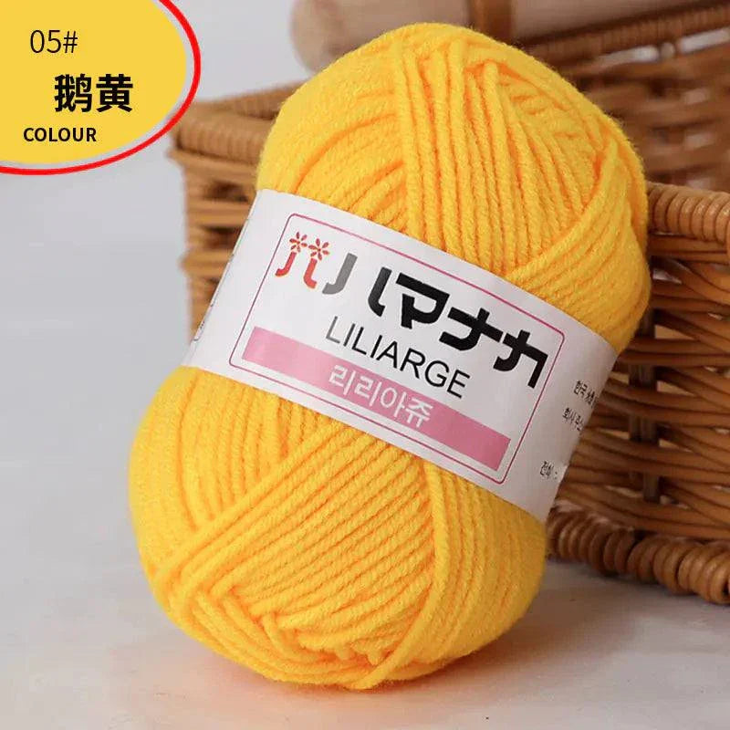 Bright yellow 4-ply Milk Cotton Yarn ball for baby dolls and crochet projects