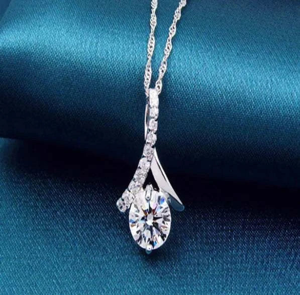 Silver zircon pendant necklace with sparkling crystal centerpiece and elegant design