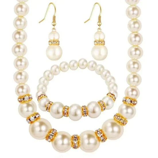 Elegant round ABS imitation pearl necklace, bracelet, and earrings set with gold and rhinestone accents for women.