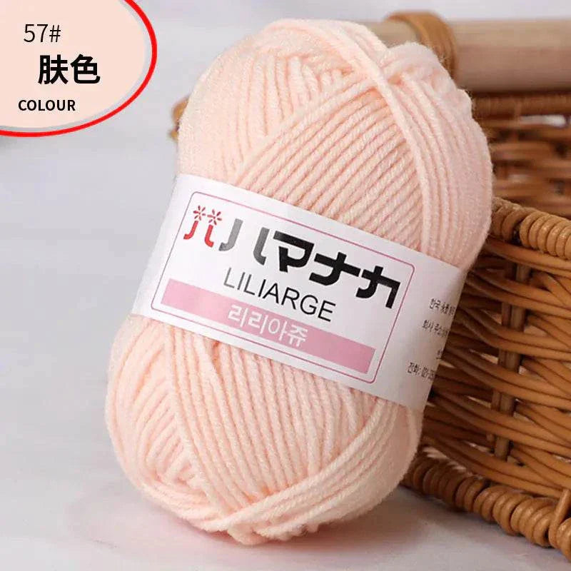 Soft 4-ply milk cotton yarn ball in light peach color for baby dolls and crochet projects