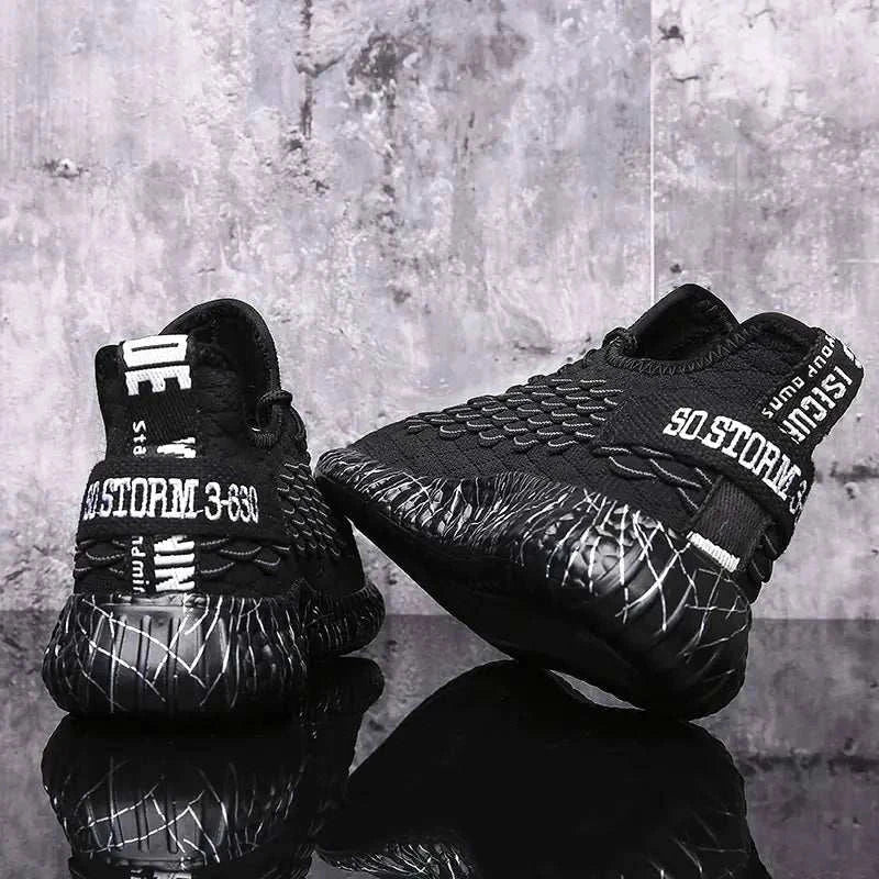 Black sports running shoes with textured design and comfortable sole held in hand