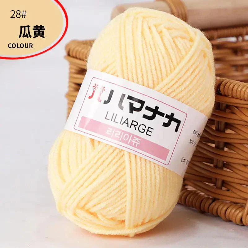Soft pale yellow 4-ply milk cotton yarn ball for baby dolls and crochet projects