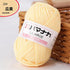 Soft pale yellow 4-ply milk cotton yarn ball for baby dolls and crochet projects