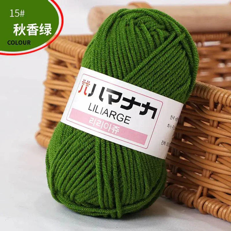 Green 4-ply milk cotton yarn skein for baby dolls and crochet projects