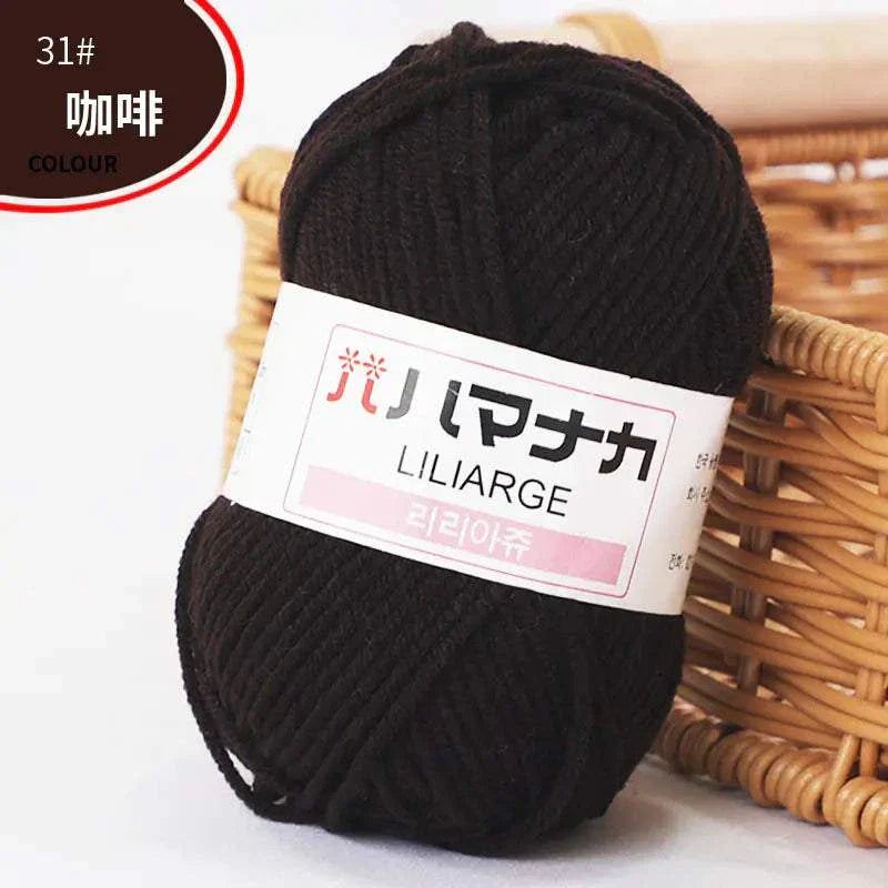 Dark brown 4-ply milk cotton yarn ball for baby dolls and crochet projects with Japanese label