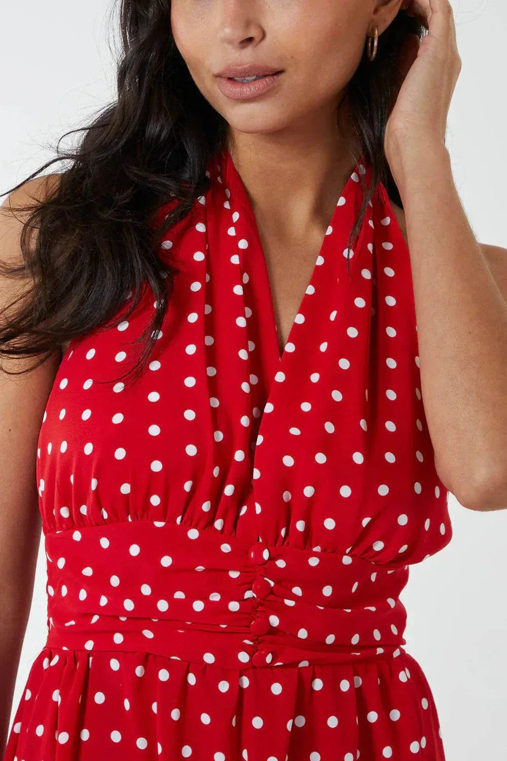 Red polka dot halterneck maxi dress with button belt and sleeveless design