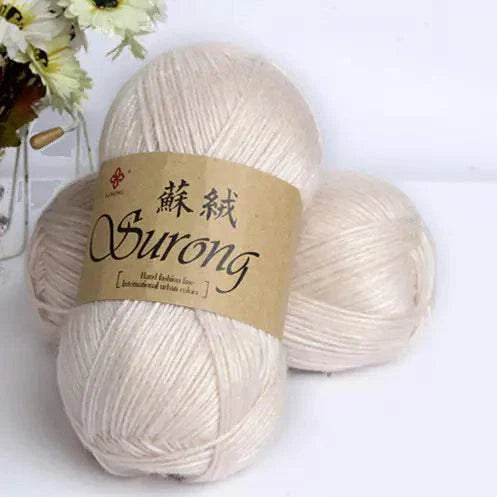 Soft cream-colored yarn balls labeled Surong for DIY knitting projects like scarves and hats