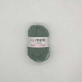 green 4-ply milk cotton yarn ball for baby dolls and crochet with Japanese label