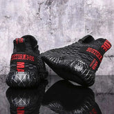 Black sports running shoes with textured design and comfortable sole held in hand