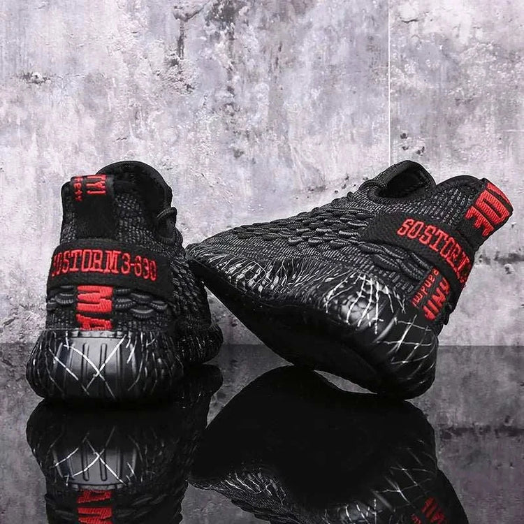 Black sports running shoes with textured design and comfortable sole held in hand