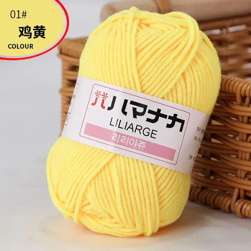 Yellow 4-ply milk cotton yarn ball for baby dolls and crochet projects